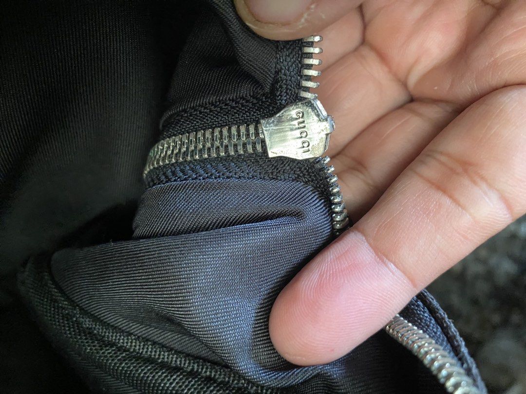 Gucci GG Supreme Canvas Backpack (Category: Backpacks) located in Alburquerque. Submitted by zanegavynn43872 (Listing ID 1466806632, Image 3). Description: - Authentic Gucci backpack not guarantee in classic black GG monogram canvas - Features a front leather patch with embossed branding - Secure zipper closure with branded hardware pulls - Durable fabric interior lining with an inner pocket - Includes interior leather tag with serial number 4499