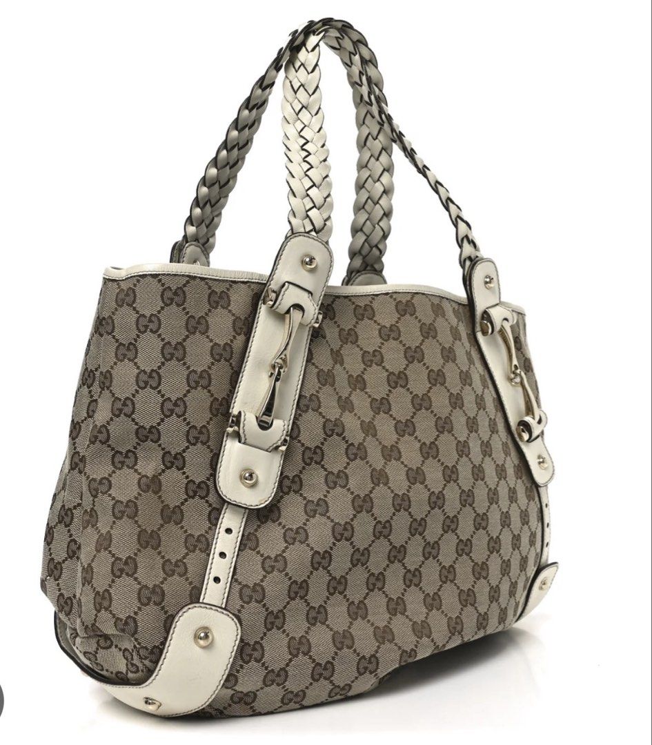 Gucci Pelham Tote Bag (Category: Tote Bags) located in Bulacan. Submitted by mersain (Listing ID 1466951192, Image 2). Description: MESSAGE FOR ACTUAL PICS NALANG PO! - vintage Gucci monogram canvas shoulder bag - Iconic beige and brown GG pattern with cream white leather trim - Elegant braided top handles for comfortable carrying - Silver-tone hardware with signature horsebit details - Spacious interior for all your daily essentials - Structured