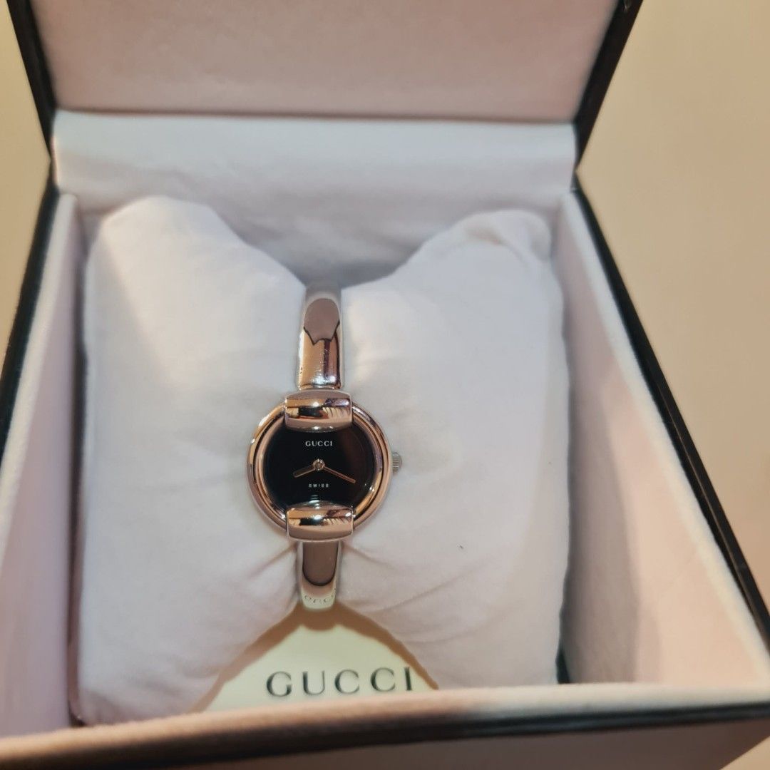Gucci Watch Black Dial (Category: Women's Watches) located in Navotas City. Submitted by ryjayshoppe (Listing ID 1466868474, Image 1). Description: Onhand and Ready to ship Original Preloved GG Watch in Silver Tone Almost New Condition!🥰Makinis❤️ S-m size up to 17.5cm with Original Box Last Price Posted!Low ballers will not entertained! Free shipping nationwide! 📌DISCLAIMER📌 We are not affiliated, associated, or in any way officially connected