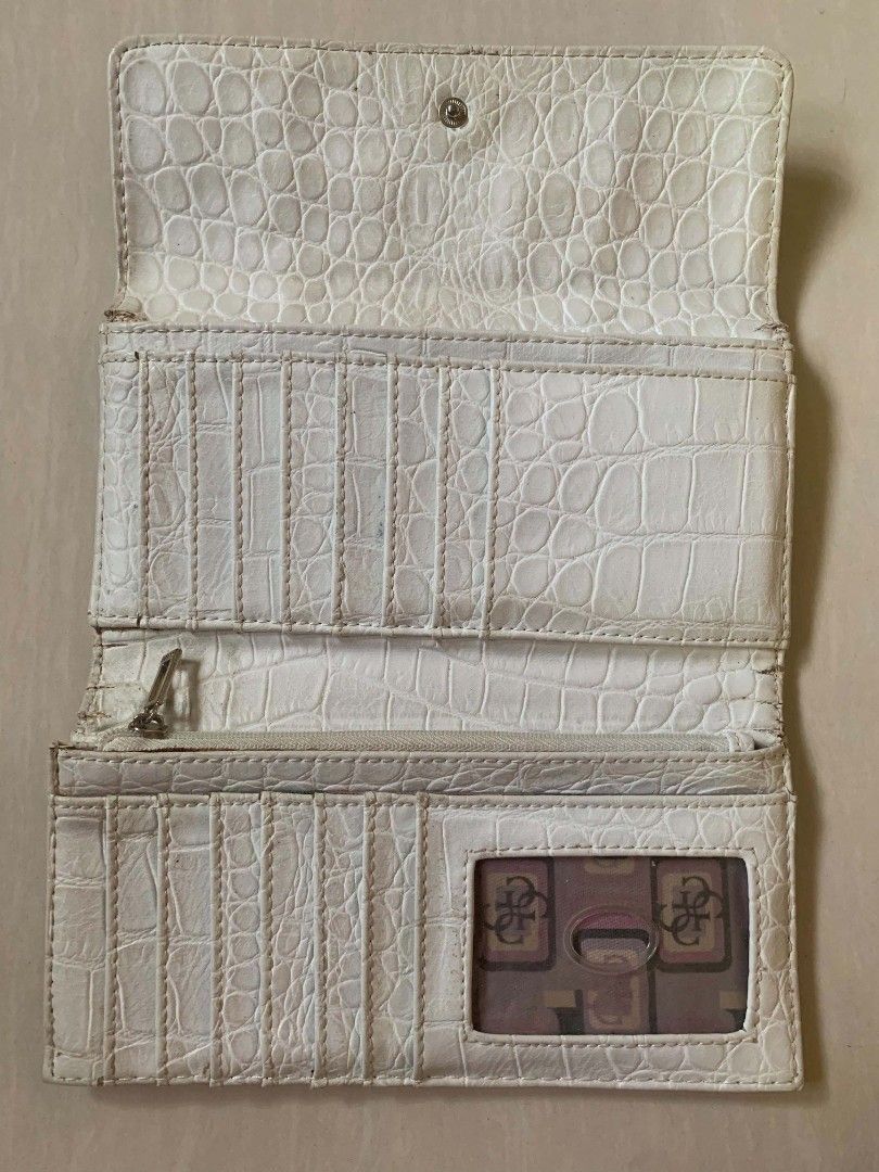 Guess Crocodile Pattern Long Wallet Off-White Beige (Category: Wallets & Card holders) located in Tiaong. Submitted by cdoswan (Listing ID 1466820424, Image 3). Description: HEARING OFFERS!! - Authentic-style GUESS long wallet in off-white & beige crocodile-embossed faux leather - Elegant gold-tone front logo with decorative strap & buckle detail - Secure snap button closure - Multiple card slots & clear ID window inside - Zippered coin compartme