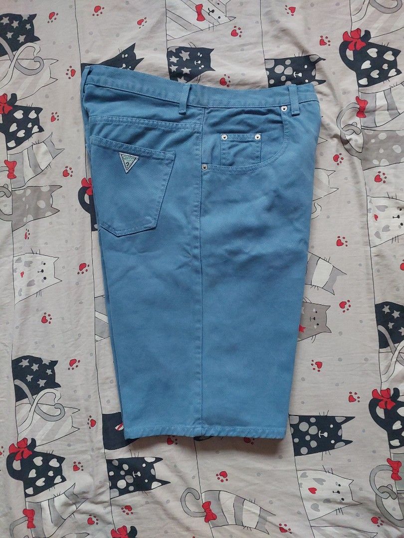 Guess jorts Size 30 (Category: Shorts) located in Cebu City. Submitted by choithrift0326 (Listing ID 1466869696, Image 3). Description: - Brand: Guess - Fit: Mid-rise, straight leg - Design: Classic five-pocket style with belt loops - Details: Small Guess triangle logo patch on the back pocket, clean stitching throughout - Condition/Vibe: Great casual piece for warm weather.