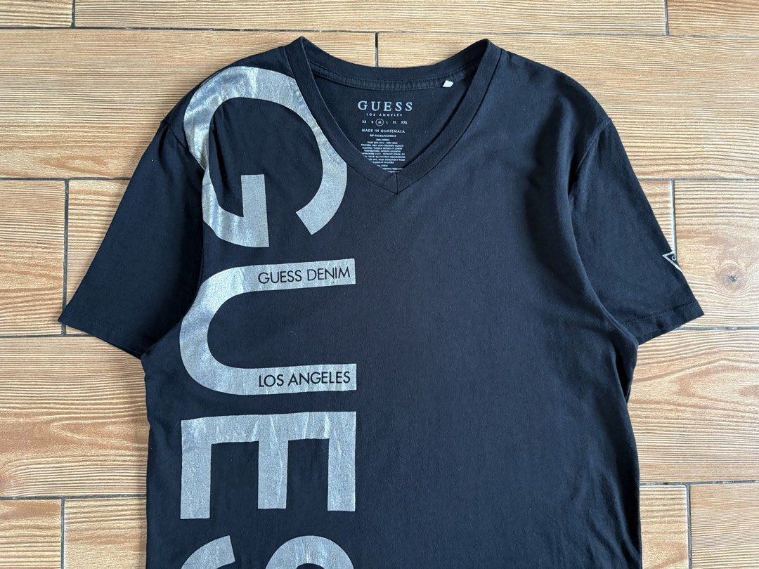 GUESS SHORT SLEEVE VNECK TSHIRT (Category: Tshirts & Polo Shirts ) located in Baras. Submitted by jnc__apparel (Listing ID 1466908150, Image 2). Description: 🏷️ GUESS SHORT SLEEVE VNECK TSHIRT 📌 Dimes: 27L x 19W 📌 Size: Medium for men 📌 Condition: Excellent 📌 Color rate: 9.5/10 📌 Issue: Hairlike crack ✅ Washed and ready to wear.