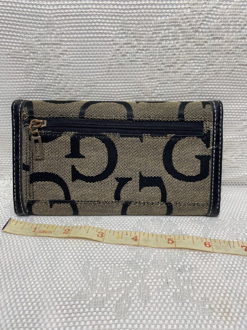 Guess wallet (Category: Wallets & Card holders) located in Angeles City. Submitted by noagrace (Listing ID 1466785396, Image 2). Description: Guess long wallet Canvas, faux leather material Normal signs of use Needs cleaning P350.