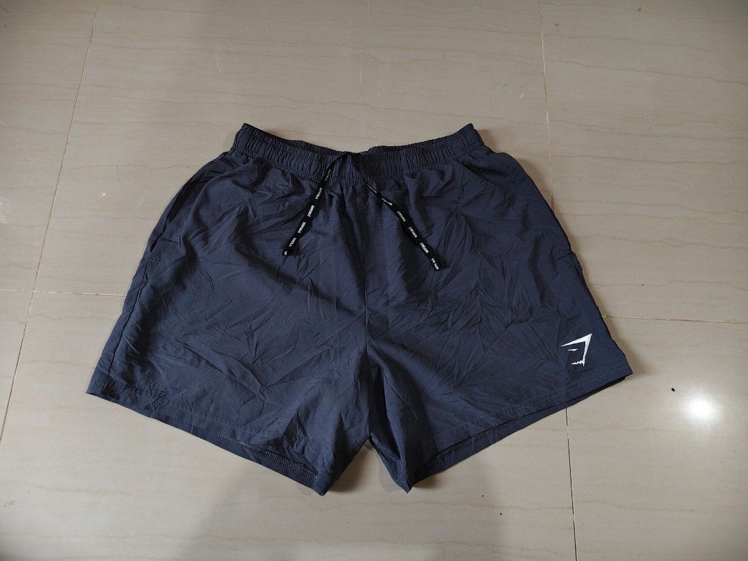 Gymshark Woven Short Size Small (Category: Shorts) located in Iloilo. Submitted by branded-boy0422_16 (Listing ID 1466822355, Image 1). Description: W:28-32 L: 14 Good as new Need washed only.
