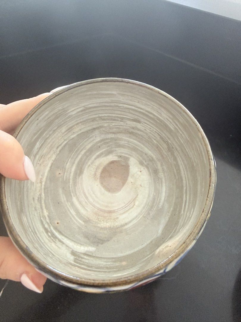 Handmade Ceramic Bowl with Colorful Circle Pattern (Category: Vases & Decorative Bowls) located in Taguig. Submitted by mengxir20193848 (Listing ID 1466813006, Image 2). Description: - Handcrafted round ceramic bowl - Intricate multicolored circular patterns on the exterior - Swirled white and grey glazed interior with visible wheel throwing marks - Unglazed raw clay base with a textured feel - Sturdy and durable build - Ideal as a decorative acc