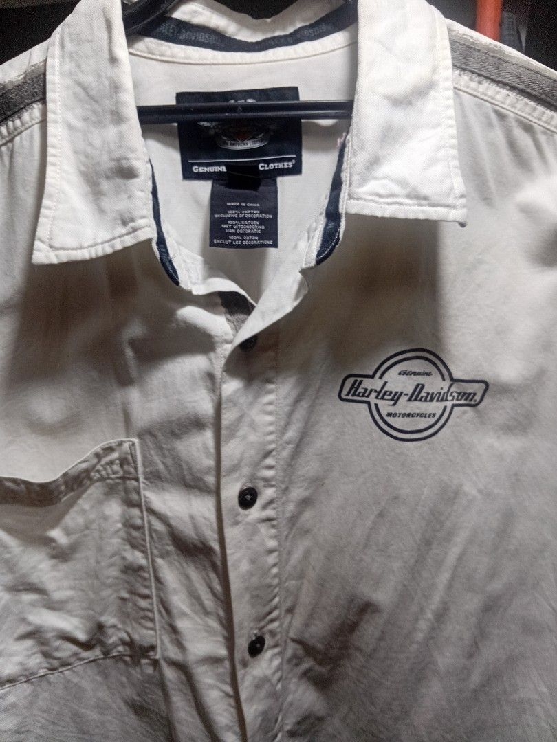 Harley Davidson Genuine Clothes Button-Up Shirt White (Category: Tshirts & Polo Shirts ) located in Manila. Submitted by newfish_883539 (Listing ID 1466870831, Image 1). Description: Brand: Harley-Davidson (Genuine Clothes / An American Legend line) Size: XL (Extra Large) Color: Cream / Off-White Material: 100% Premium Cotton Key Features: • Left chest: Embroidered retro circular Harley-Davidson Motorcycles logo. • Upper back: Stitched Harley-Dav