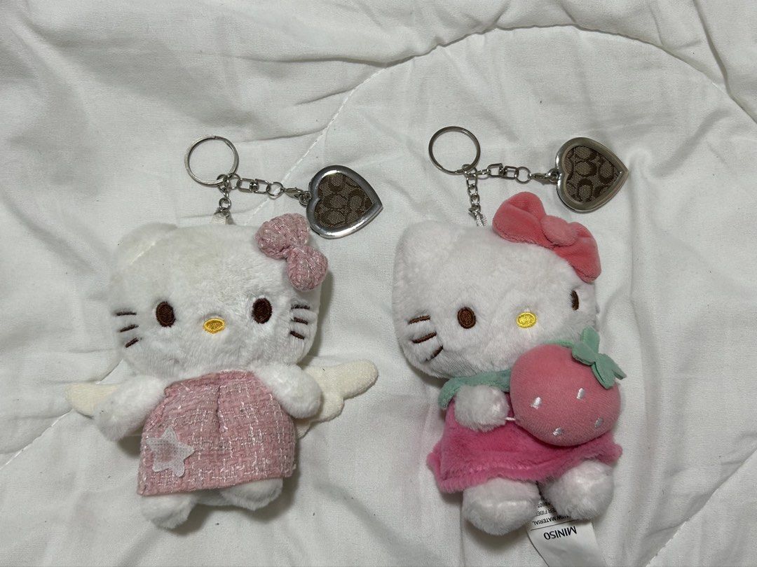 Hello Kitty and Coach Heart Charm duo (Category: Character Goods) located in Santa Rita. Submitted by chloeclosette (Listing ID 1466801658, Image 1). Description: - Kitty plush keychain with coach charms 1st hello kitty- not og 2nd hello kitty- og (from miniso) Made out of auth coach project bag Loc- Pampanga.