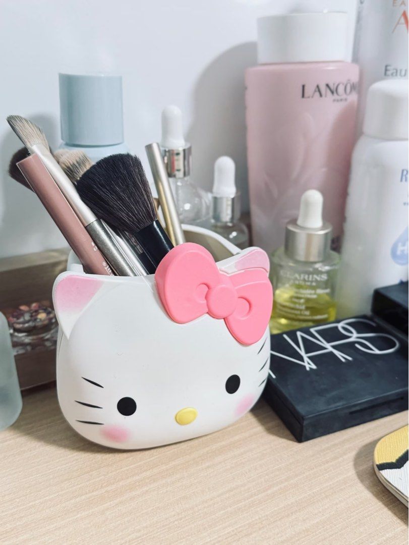 Hello Kitty Desk Organizer Pen Holder (Category: Stationery & School Supplies) located in Taguig. Submitted by mengxir20193848 (Listing ID 1466814391, Image 1). Description: - Adorable Kitty design with a pink bow, cheeks, and whiskers - Versatile organizer for makeup brushes, pens, or loose change - Clean white finish with a sturdy, flat base - Great desk accessory and must-have for Sanrio fans.