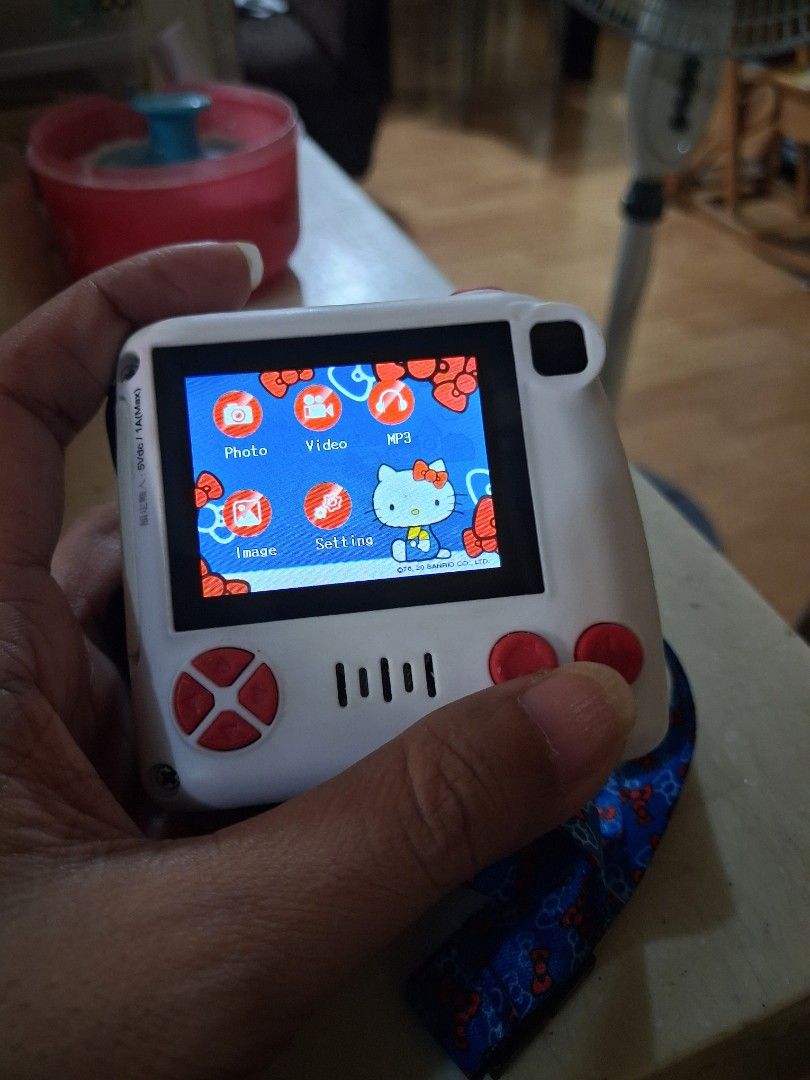 Hello Kitty Digital Camera with Strap (Category: Cameras) located in Manila. Submitted by hellokitty88235 (Listing ID 1466896598, Image 2). Description: - Authentic Kitty digital camera in white and blue - Adorable ribbon design on the front lens and matching strap - Multi-functional menu: supports photo, video, MP3, and settings - Clear, fully working screen - Compact and lightweight, very easy to hold and carry.