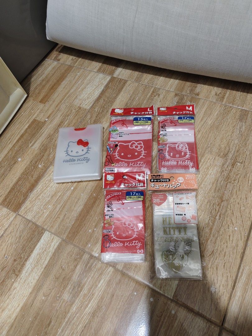 Hello Kitty Ziplock Bags and Storage Case Set (Category: Purses & Pouches) located in Makati City. Submitted by abegailbrezuela (Listing ID 1466824499, Image 2). Description: - Authentic Sanrio Kitty merchandise from 2005 - Includes 1 frosted plastic dispenser case with a 3D red bow snap closure - Comes with 4 unopened packs of Kitty resealable ziplock bags - Size breakdown: 2 medium red packs (17 pcs each), 1 large red pack (15 pcs), and 1 mini 