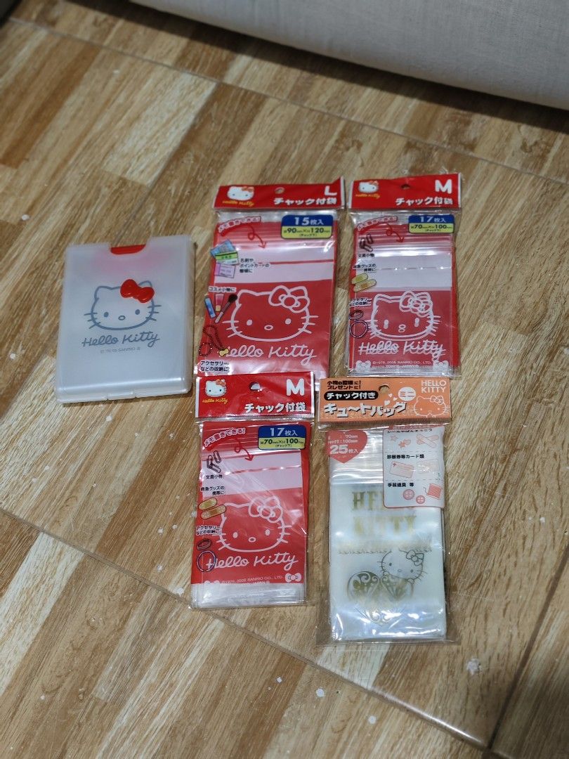 Hello Kitty Ziplock Bags and Storage Case Set (Category: Purses & Pouches) located in Makati City. Submitted by abegailbrezuela (Listing ID 1466824499, Image 1). Description: - Authentic Sanrio Kitty merchandise from 2005 - Includes 1 frosted plastic dispenser case with a 3D red bow snap closure - Comes with 4 unopened packs of Kitty resealable ziplock bags - Size breakdown: 2 medium red packs (17 pcs each), 1 large red pack (15 pcs), and 1 mini 