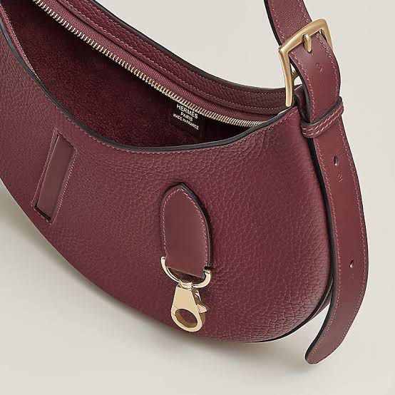 Hermes Arcon Slim Bag Rouge H (Category: Luxury Bags & Wallets) located in Quezon City. Submitted by kellypochette (Listing ID 1466857346, Image 2). Description: A modern Hermès silhouette in the iconic Rouge H. Understated, effortlessly chic, and refreshingly different from the usual Hermès classics. BAG DETAILS * Brand: Hermès * Model: Arçon Slim * Color: Rouge H * Leather: Togo * Hardware: Permabrass * Condition: Brand New / Unused * Inclusion