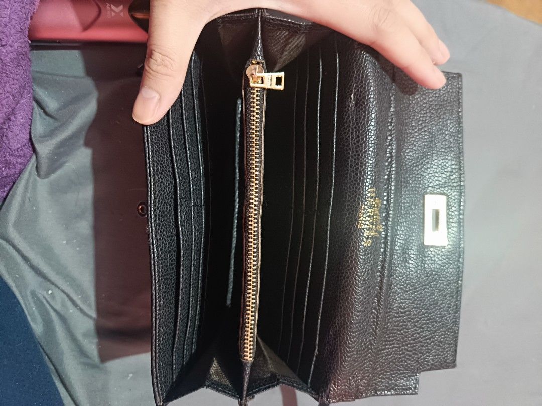 (Inspired only) Hermes Kelly longue wallet (Category: Luxury Bags & Wallets) located in Manila. Submitted by mikashanggg (Listing ID 1466964590, Image 3). Description: Classy black pebble textured leather long wallet with gold hardware and secure snap closure. Features plenty of card slots, slip pockets, and a zippered coin compartment inside. Perfect for everyday use! .