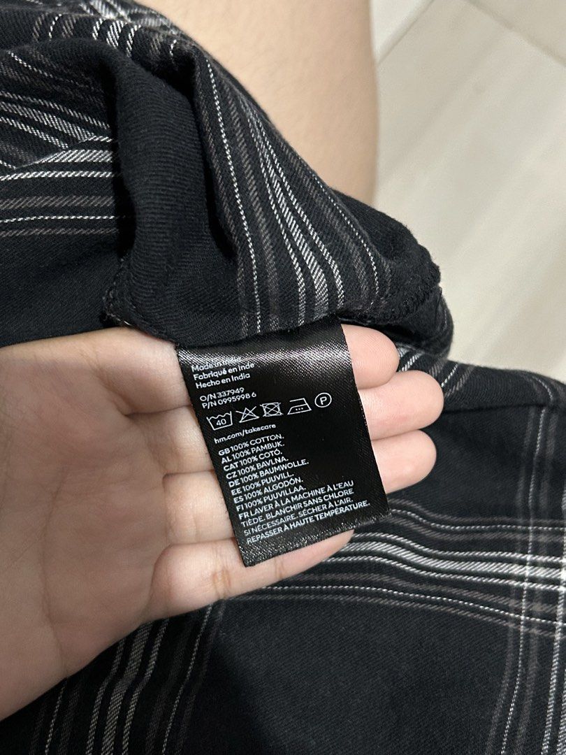 H&M Divided Black Plaid Button-Down Shirt Size M (Category: Coats, Jackets and Outerwear) located in Manila. Submitted by yarzkyhan (Listing ID 1466855324, Image 3). Description: - Can do meetups around mnl - Brand: H&M Divided - Size: Medium (Regular Fit) - Color/Pattern: Black and white plaid - Material: 100% cotton (soft, breathable, and easy to machine wash) - Features: Long sleeves, classic collar, front chest pocket, and black button closur