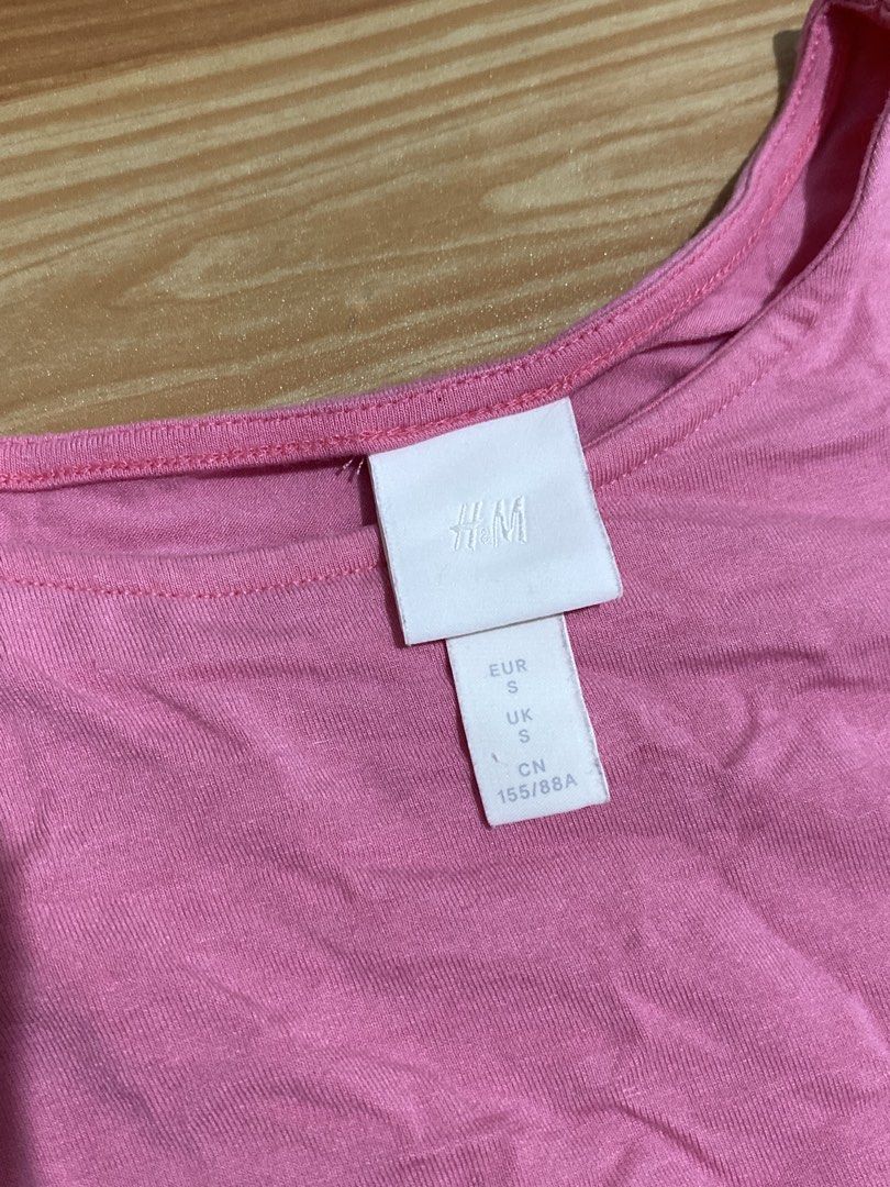 H&M Pink Top with Puff Sleeves Size S (Category: Blouses) located in Manila. Submitted by zapitup (Listing ID 1466967049, Image 2). Description: - Brand: H&M - Size: S (EUR/UK S, CN 155/88A) - Color: Bright pink - Features: Sheer puff sleeves with elastic cuffs, rounded neckline - Material: Soft body fabric with lightweight sleeves - Fit: Standard fit, casual everyday style - Condition: Excellent / Well-maintained.