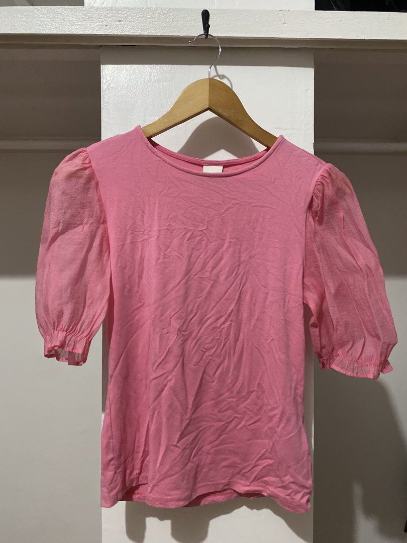 H&M Pink Top with Puff Sleeves Size S (Category: Blouses) located in Manila. Submitted by zapitup (Listing ID 1466967049, Image 1). Description: - Brand: H&M - Size: S (EUR/UK S, CN 155/88A) - Color: Bright pink - Features: Sheer puff sleeves with elastic cuffs, rounded neckline - Material: Soft body fabric with lightweight sleeves - Fit: Standard fit, casual everyday style - Condition: Excellent / Well-maintained.