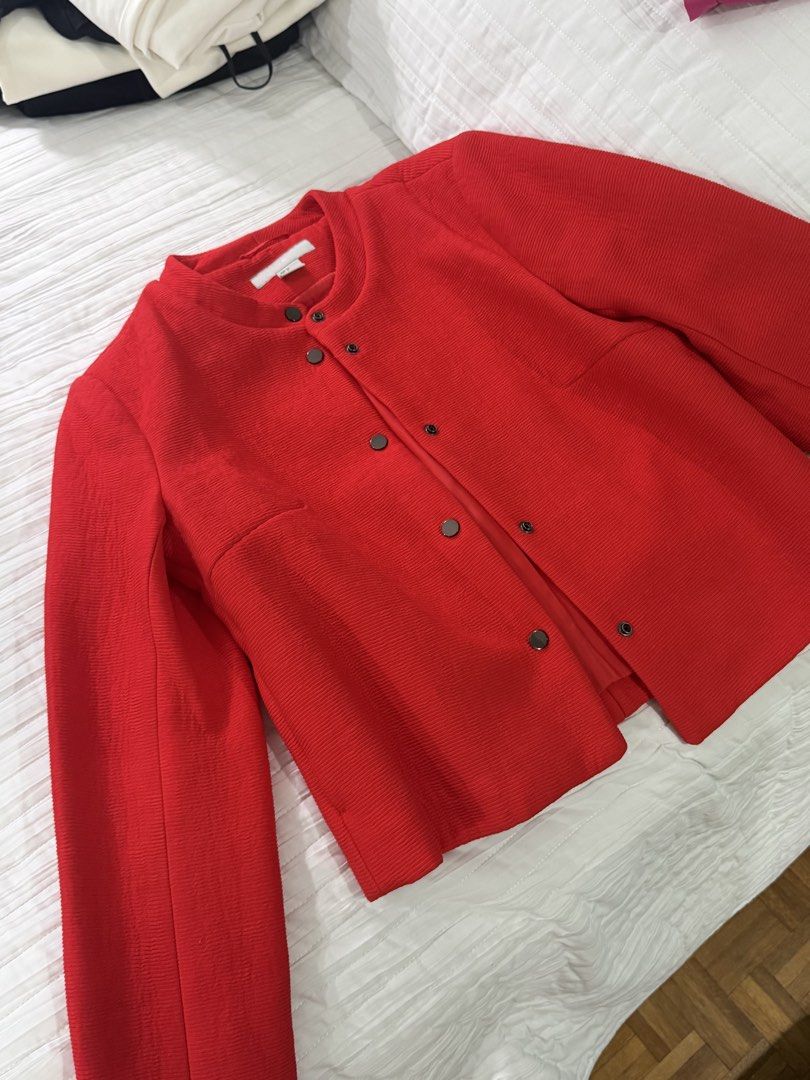 H&M Red Textured Button-Up Jacket EUR 34 US 4 (Category: Coats, Jackets and Outerwear) located in Quezon City. Submitted by afternoonstore (Listing ID 1466840991, Image 2). Description: - Brand: H&M - Color: Vibrant Red - Size: EUR 34 / US 4 / CN 160/80A - Material/Design: Textured weave pattern with full lining - Features: Round neckline and front snap button closure - Condition: Clean and well-maintained.