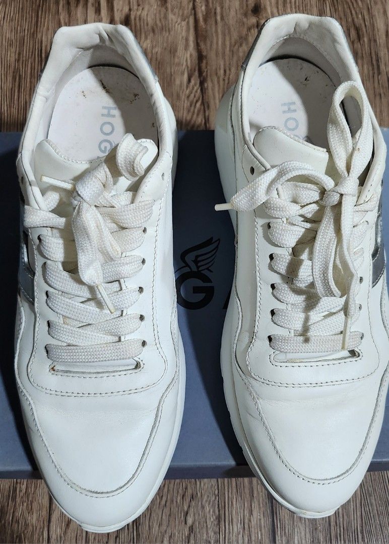 Hogan Interactive (Category: Sneakers) located in Taytay. Submitted by luxebagcray (Listing ID 1466879045, Image 3). Description: - Brand: Hogan - Color: White leather with silver and cream details - Features: Silver side logo (with visible cracking on metallic finish), white laces, chunky rubber soles - Condition: Minor dirt marks on insoles from wear - Inclusions: Original blue box, dust bag, and brand card - Original price is 11k.