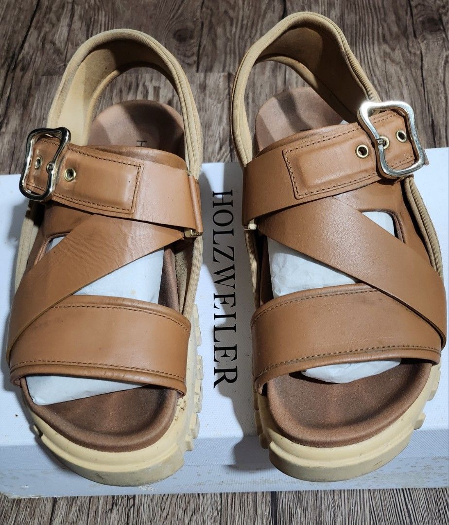 Holzweiler Tan Platform Sandals Size 37 with Box (Category: Sandals) located in Taytay. Submitted by luxebagcray (Listing ID 1466877269, Image 2). Description: - Brand: Holzweiler - Color: Tan - Size: EU 37 - Material: Premium leather - Design: Chunky platform sole with deep treads, adjustable top buckle strap, and secure heel strap - Comfort: Soft footbed with printed Holzweiler logo - Inclusions: Original white storage box - Condition: Excellen