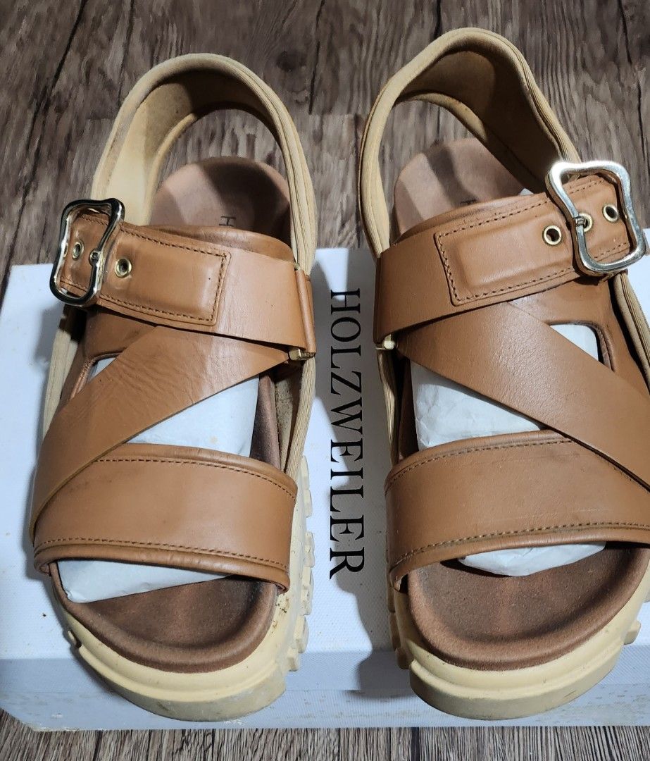 Holzweiler Tan Platform Sandals Size 37 with Box (Category: Sandals) located in Taytay. Submitted by luxebagcray (Listing ID 1466877269, Image 1). Description: - Brand: Holzweiler - Color: Tan - Size: EU 37 - Material: Premium leather - Design: Chunky platform sole with deep treads, adjustable top buckle strap, and secure heel strap - Comfort: Soft footbed with printed Holzweiler logo - Inclusions: Original white storage box - Condition: Excellen