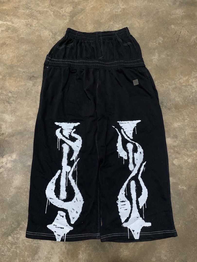 Hooligans H pants (Category: Joggers) located in Cavite. Submitted by zoomnotfound (Listing ID 1466855125, Image 1). Description: - Style: Bold streetwear black wide-leg casual pants - Fit: Relaxed wide-leg cut with an adjustable elastic drawstring waistband - Details: Eye-catching contrast white stitching and large white abstract graffiti print on both lower legs - Back: Simple subtle tag detail on the upper back - Versatility: Easy to style wit