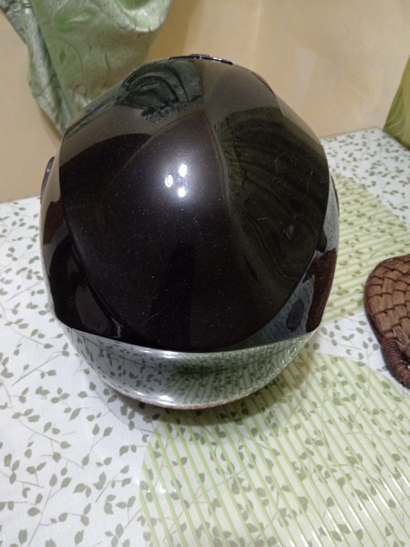 HPH Full Face Motorcycle Helmet Black (Category: Caps & Hats) located in Quezon City. Submitted by mylittlebaby2525 (Listing ID 1466895665, Image 2). Description: - Brand/Model: HPH Full Face Motorcycle Helmet - Finish: Sleek glossy black with a clear visor - Ventilation: Top air vent on the crown for airflow - Comfort: Padded interior lining - Closure: Standard secure strap underneath - Condition: Clean exterior with minimal wear, perfect as a s