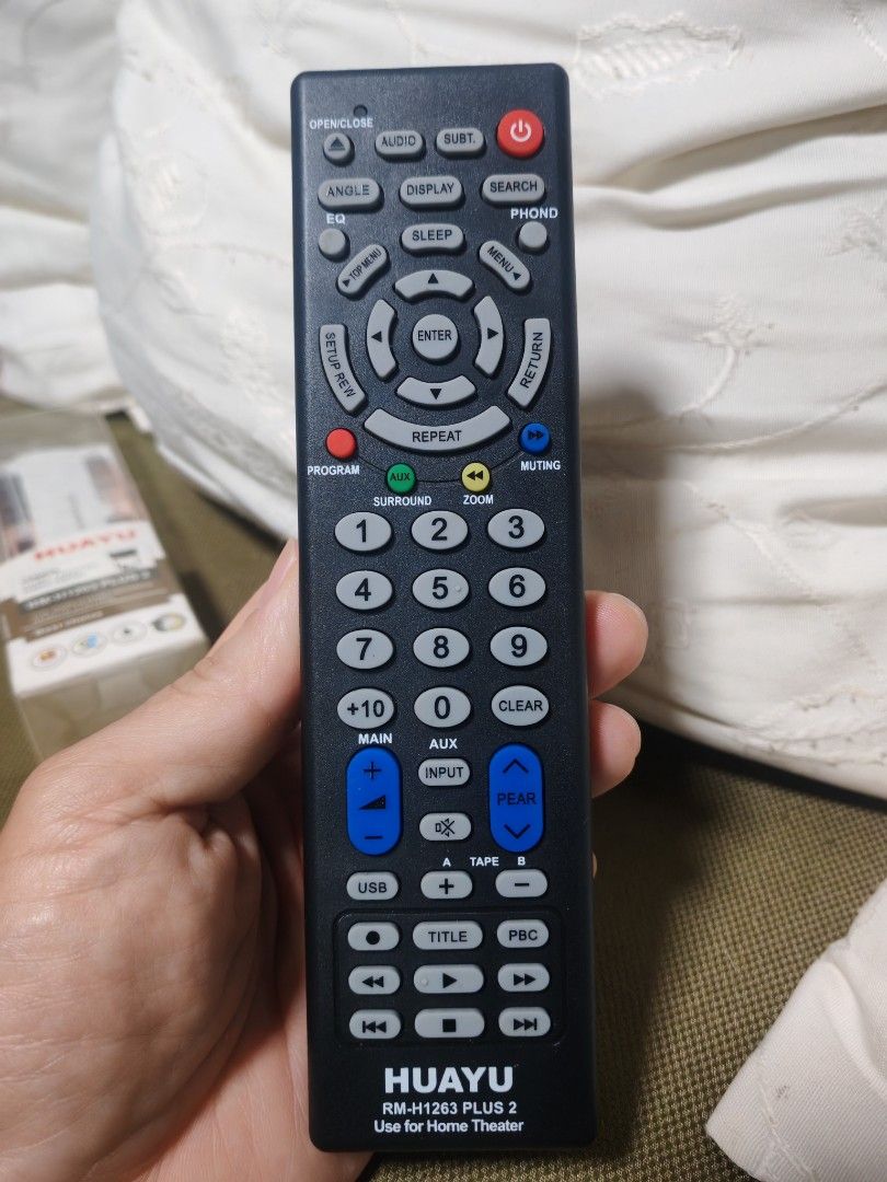 HUAYU RM-H1263 PLUS 2 Home Theater Remote Control (Category: TV Parts & Accessories) located in Trece Martires City. Submitted by chipmaster74 (Listing ID 1466780709, Image 3). Description: - Model: HUAYU RM-H1263 PLUS 2 Home Theater Universal Remote - Condition: Like new, and still in original plastic sleeve. Tried only once. - Setup: Universal setup with easy code input instructions printed directly on the back - Design: Classic black body feat