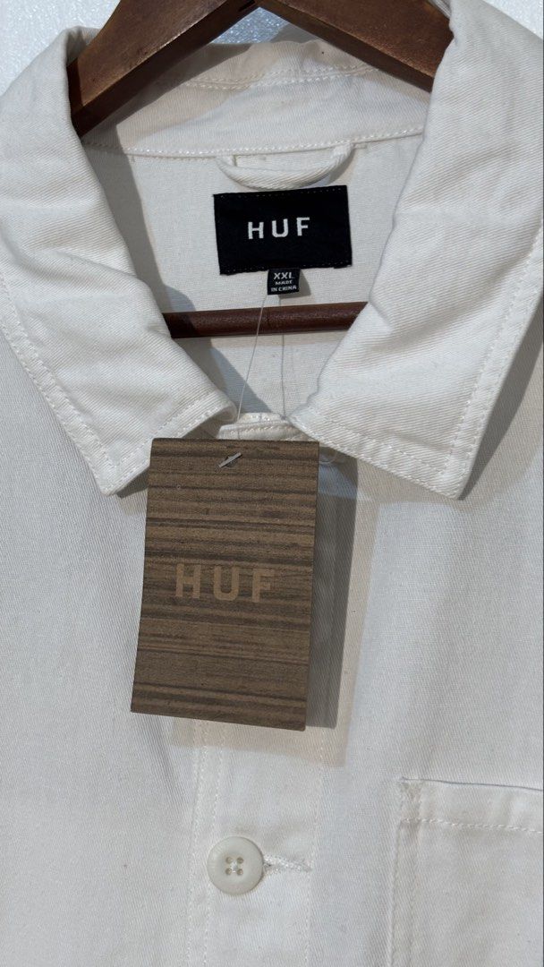 HUF x Thrasher White Long Sleeve Work Jacket XXL (Category: Coats, Jackets and Outerwear) located in Manila. Submitted by glano (Listing ID 1466917252, Image 3). Description: - Brand: HUF x Thrasher - Condition: Brand new with original store hangtag attached - Size: XXL - Color: White - Design: Button-up front, fold-over collar, and button cuffs - Pockets: Multiple utility pockets on the chest and lower front - Branding: Small woven globe patch o