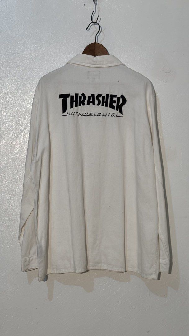 HUF x Thrasher White Long Sleeve Work Jacket XXL (Category: Coats, Jackets and Outerwear) located in Manila. Submitted by glano (Listing ID 1466917252, Image 2). Description: - Brand: HUF x Thrasher - Condition: Brand new with original store hangtag attached - Size: XXL - Color: White - Design: Button-up front, fold-over collar, and button cuffs - Pockets: Multiple utility pockets on the chest and lower front - Branding: Small woven globe patch o