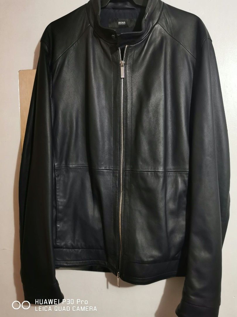 HUGO BOSS Nartimo Leather Jacket (Category: Coats, Jackets and Outerwear) located in Makati City. Submitted by relianzmae57131 (Listing ID 1466870671, Image 3). Description: - Brand: HUGO BOSS (Model: Nartimo) - Color: Classic Black - Condition: like new with original store tags attached - Material: Premium quality leather with clean paneling - Details: Full zip closure and signature branded metal hardware on the back collar - Fit: Standard fit -