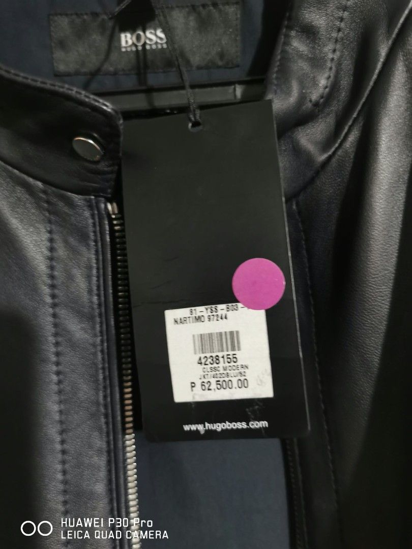 HUGO BOSS Nartimo Leather Jacket (Category: Coats, Jackets and Outerwear) located in Makati City. Submitted by relianzmae57131 (Listing ID 1466870671, Image 2). Description: - Brand: HUGO BOSS (Model: Nartimo) - Color: Classic Black - Condition: like new with original store tags attached - Material: Premium quality leather with clean paneling - Details: Full zip closure and signature branded metal hardware on the back collar - Fit: Standard fit -