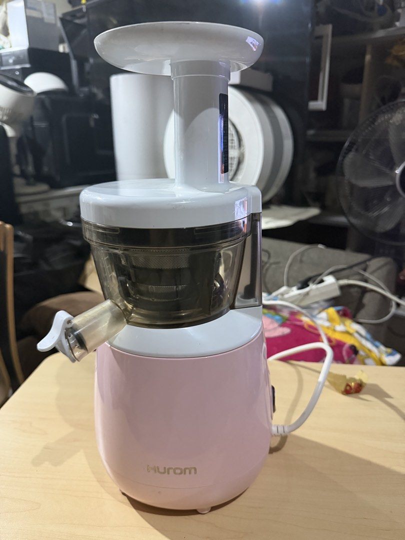 Hurom Slow Juicer (Category: Juicers, Blenders & Grinders) located in Bulacan. Submitted by mysticdeer.6d7f47 (Listing ID 1466885230, Image 1). Description: The image shows a Hurom HP Slow Juicer (model HP-PWF12 / HP-PWF12A) in a pink finish..