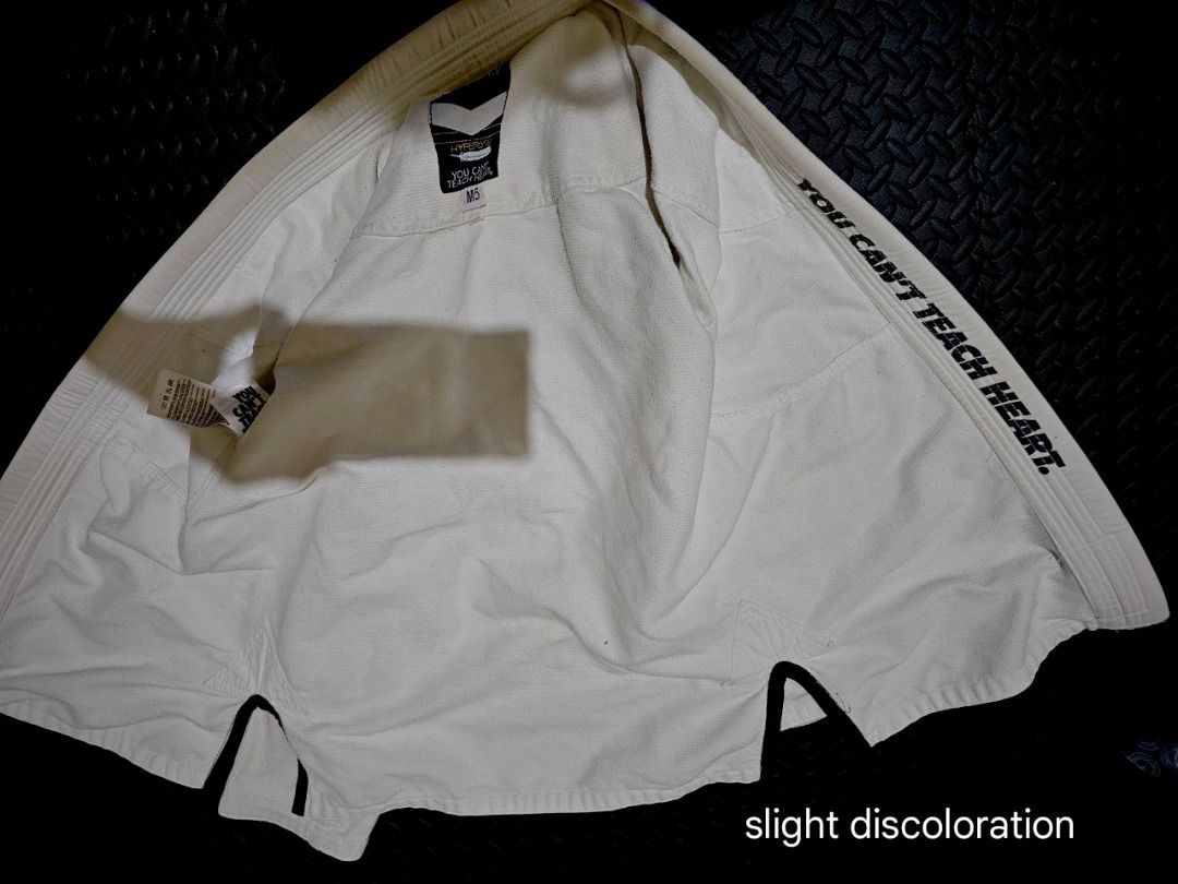Hyperlyte White BJJ Gi Set (Category: Combat Sports) located in Lapu Lapu. Submitted by goodstuff_cebu (Listing ID 1466947874, Image 3). Description: - Brand: Hyperlyte - Color: White - Set includes: Durable weave jacket and matching pants with drawstring waist - Design: Stylish black logo patches on sleeves and pant leg - Condition: Clean and ready for the mats - Ideal for: BJJ training and rolling sessions - Slight discoloration from use, but d