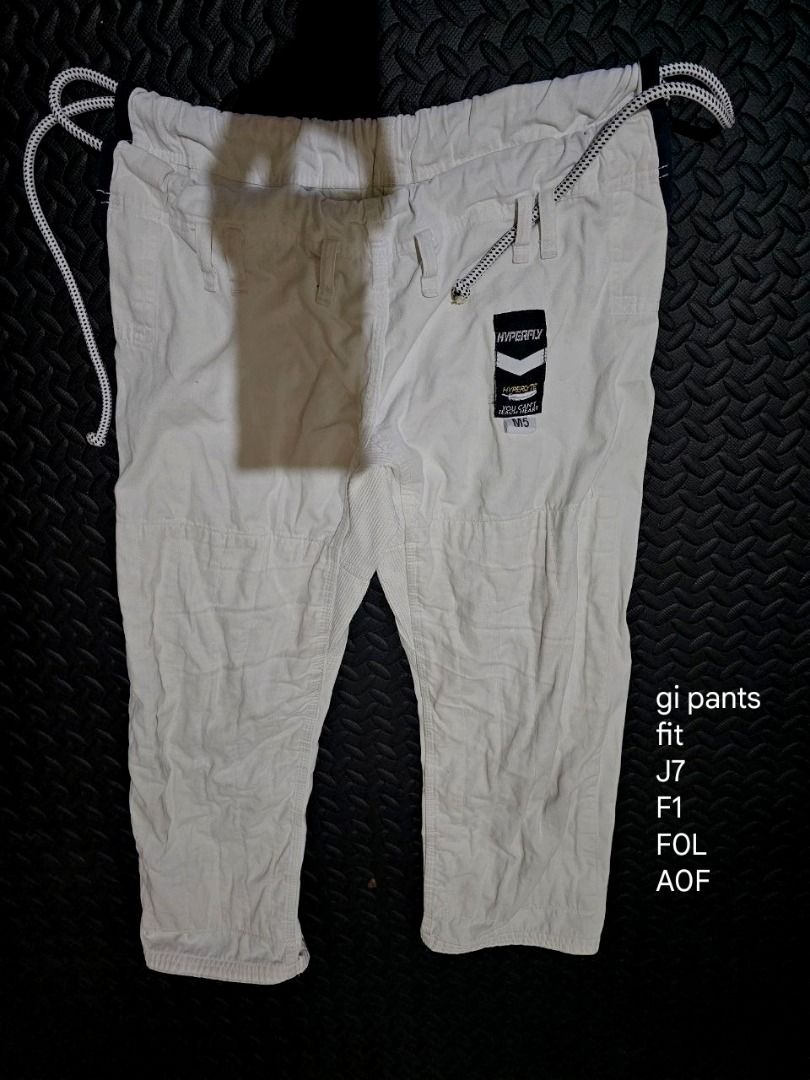 Hyperlyte White BJJ Gi Set (Category: Combat Sports) located in Lapu Lapu. Submitted by goodstuff_cebu (Listing ID 1466947874, Image 2). Description: - Brand: Hyperlyte - Color: White - Set includes: Durable weave jacket and matching pants with drawstring waist - Design: Stylish black logo patches on sleeves and pant leg - Condition: Clean and ready for the mats - Ideal for: BJJ training and rolling sessions - Slight discoloration from use, but d