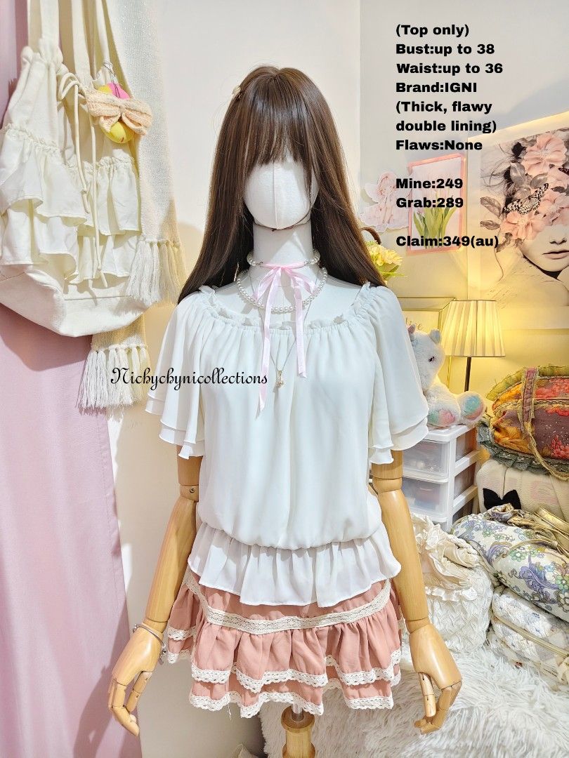 IGNI White Off Shoulder Ruffle Blouse Top (Category: Blouses) located in Manila. Submitted by chynii_28 (Listing ID 1466868355, Image 1). Description: - Brand: IGNI - Color: White - Style: Off-shoulder blouse with short layered flutter sleeves, gathered neckline, and ruffled hem - Material: Thick, flowy double lining for zero transparency and great movement - Sizing: Fits bust up to 38 inches and waist up to 36 inches - Condition: Excellent, no f