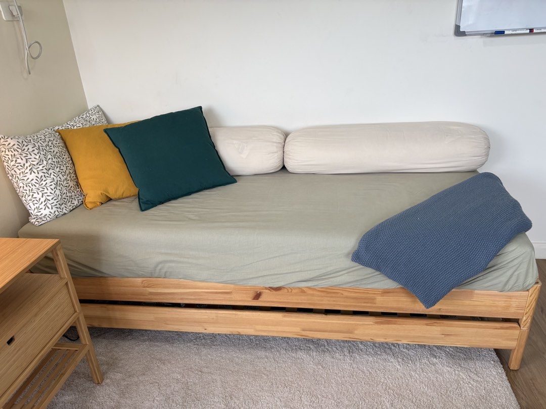 IKEA Stackable Bed Frame and Mattresses (Category: Bed Frames & Mattresses) located in Quezon City. Submitted by emmakne (Listing ID 1466819722, Image 2). Description: Stackable bed from IKEA. Can come with all pillows and bedding pictured. Beds can be stacked to become twin size. Beds can be separated to become two twin beds or one full size bed. There is one broken slat but it is still comfortable to sit/sleep on. We purchased new slats to repl