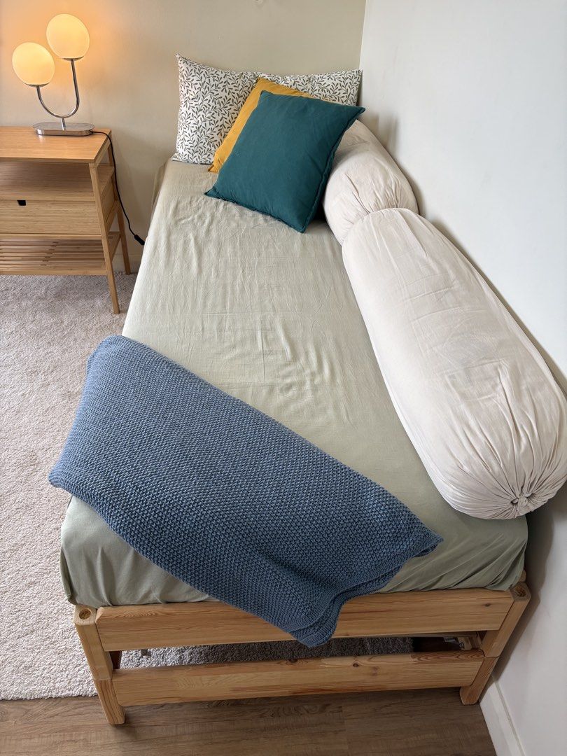 IKEA Stackable Bed Frame and Mattresses (Category: Bed Frames & Mattresses) located in Quezon City. Submitted by emmakne (Listing ID 1466819722, Image 3). Description: Stackable bed from IKEA. Can come with all pillows and bedding pictured. Beds can be stacked to become twin size. Beds can be separated to become two twin beds or one full size bed. There is one broken slat but it is still comfortable to sit/sleep on. We purchased new slats to repl