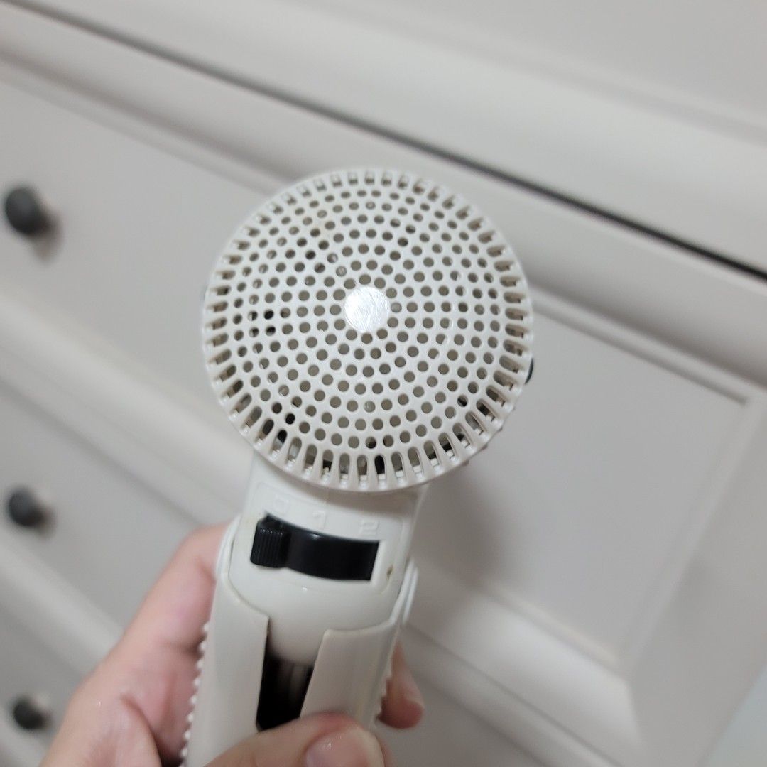 Imarflex Foldable Hair Dryer White (Category: Hair) located in Pasig City. Submitted by bunny.bella (Listing ID 1466923744, Image 3). Description: - Brand: Imarflex - Color: White - Design: Compact size with a convenient foldable handle, ideal for travel - Settings: Dual speed settings with an easy-to-use black switch - Condition: Fully functional and powers on well, with normal signs of use and slight body discoloration - Features: Circular rear