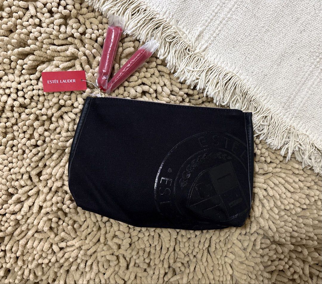Imported Estee Lauder cosmetic pouch (Category: Purses & Pouches) located in Quezon City. Submitted by heartshop.ph (Listing ID 1466791321, Image 1). Description: Black canvas material with tassle Original cosmetic pouch.