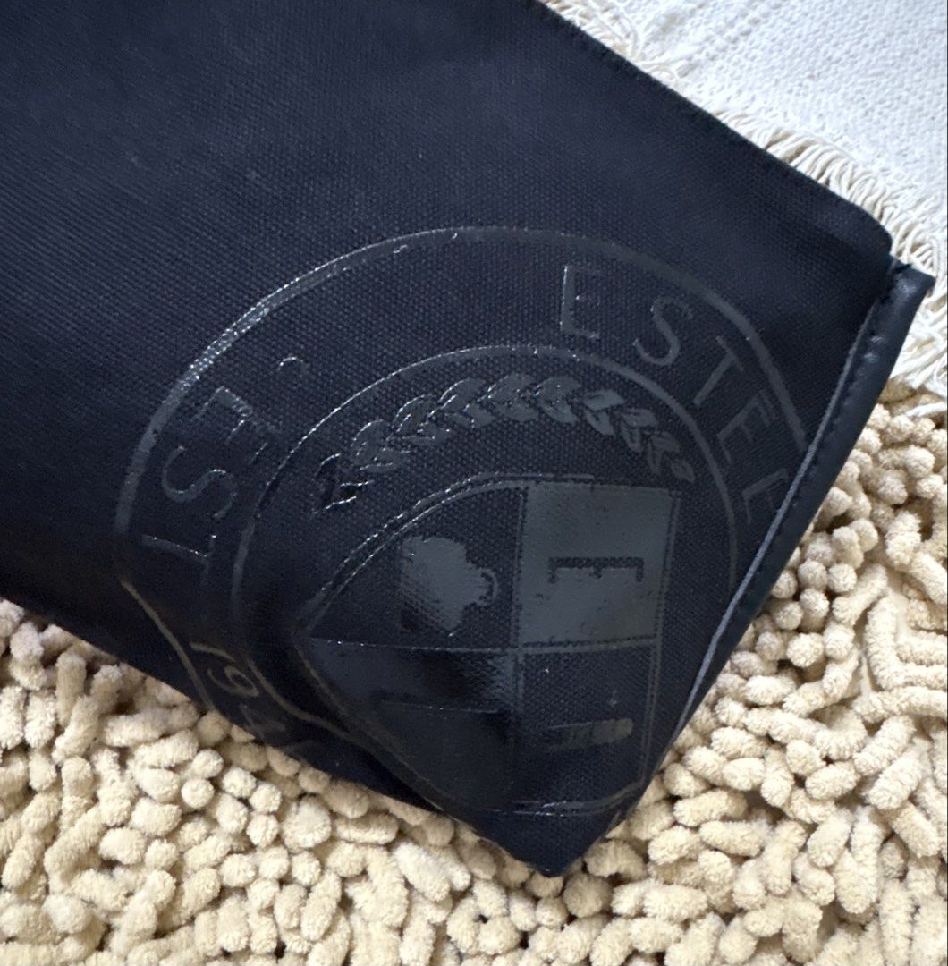 Imported Estee Lauder cosmetic pouch (Category: Purses & Pouches) located in Quezon City. Submitted by heartshop.ph (Listing ID 1466791321, Image 2). Description: Black canvas material with tassle Original cosmetic pouch.