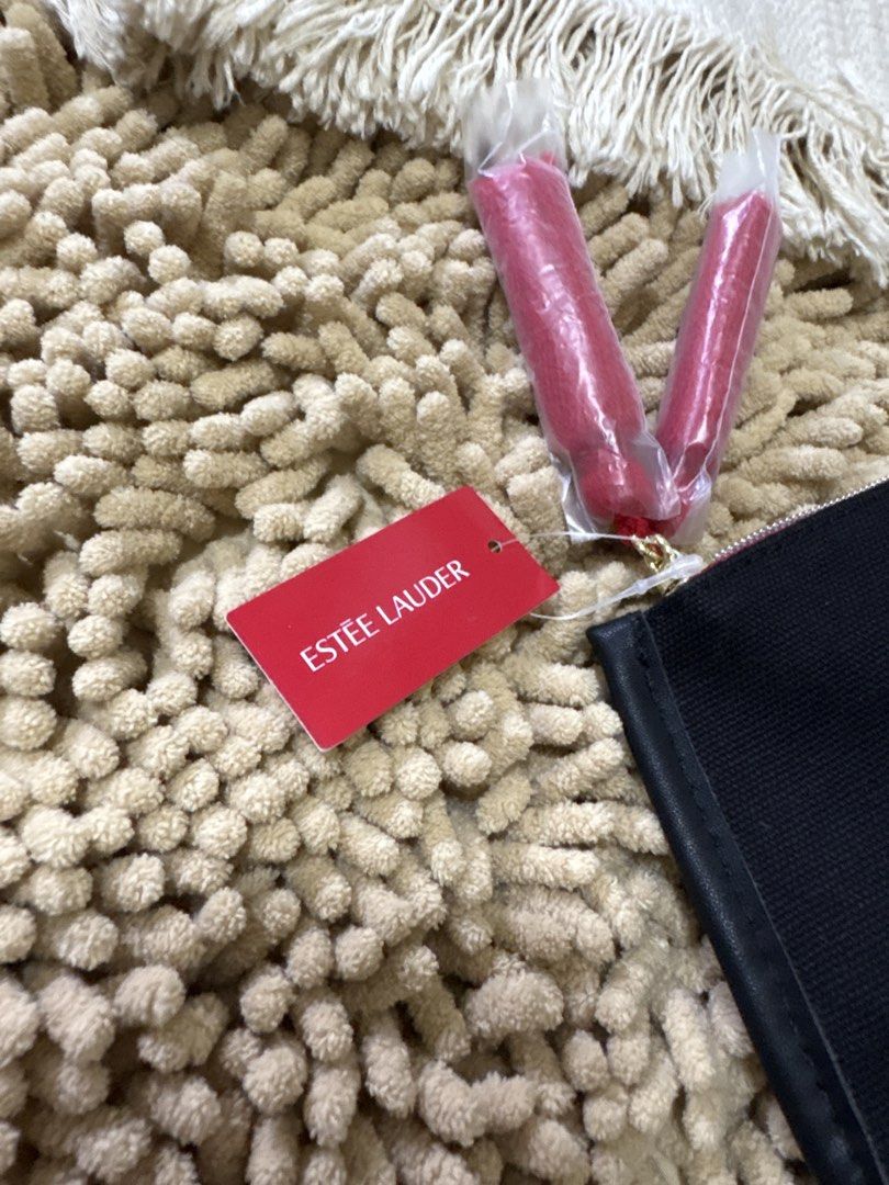 Imported Estee Lauder cosmetic pouch (Category: Purses & Pouches) located in Quezon City. Submitted by heartshop.ph (Listing ID 1466791321, Image 3). Description: Black canvas material with tassle Original cosmetic pouch.