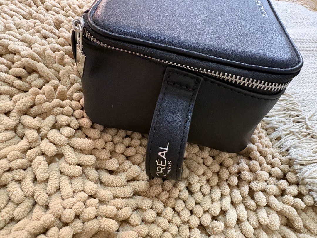 Imported Mugler x Loreal Paris Cosmetic Purse box type (Category: Purses & Pouches) located in Quezon City. Submitted by heartshop.ph (Listing ID 1466856528, Image 3). Description: Original Cosmetic Purse.