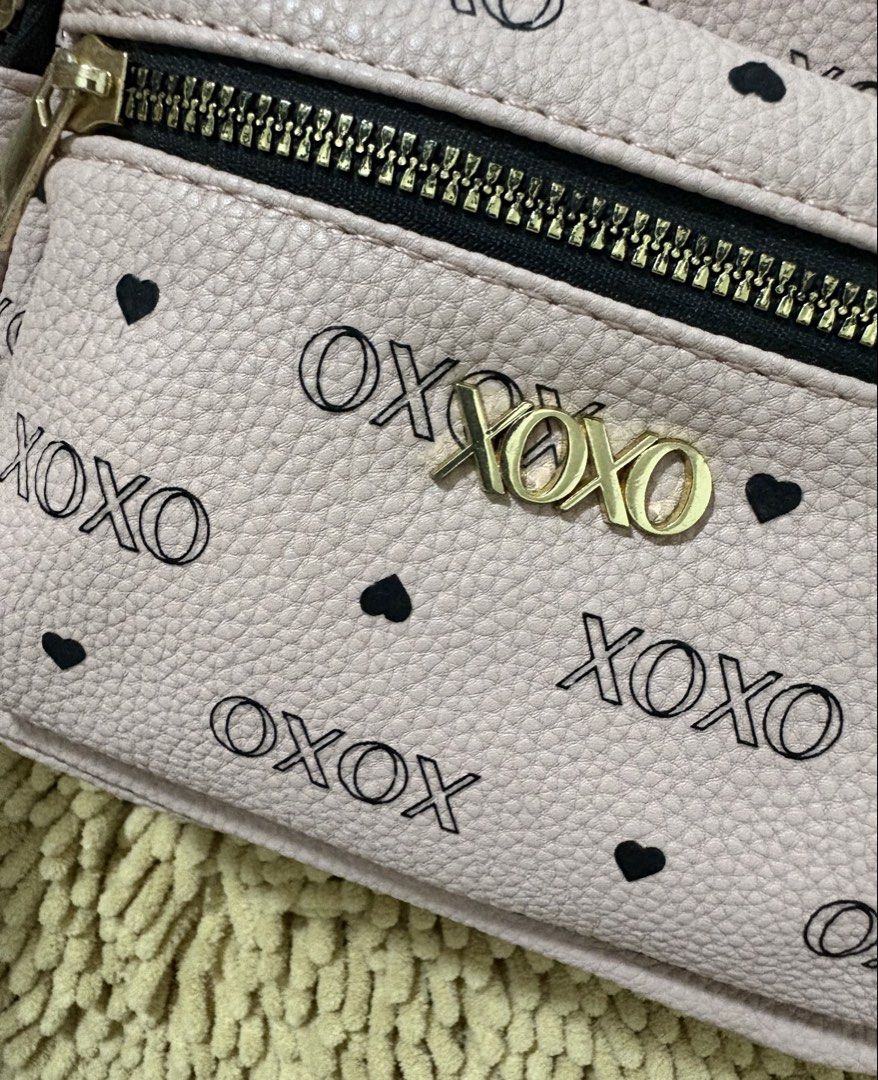Imported XOXO mini PINK backpack hearts design (Category: Backpacks) located in Quezon City. Submitted by heartshop.ph (Listing ID 1466778869, Image 2). Description: minimal stain inside the bag due to storage/ old stock item hence low posted price Original XOXO backpack with coin purse/ Imported.
