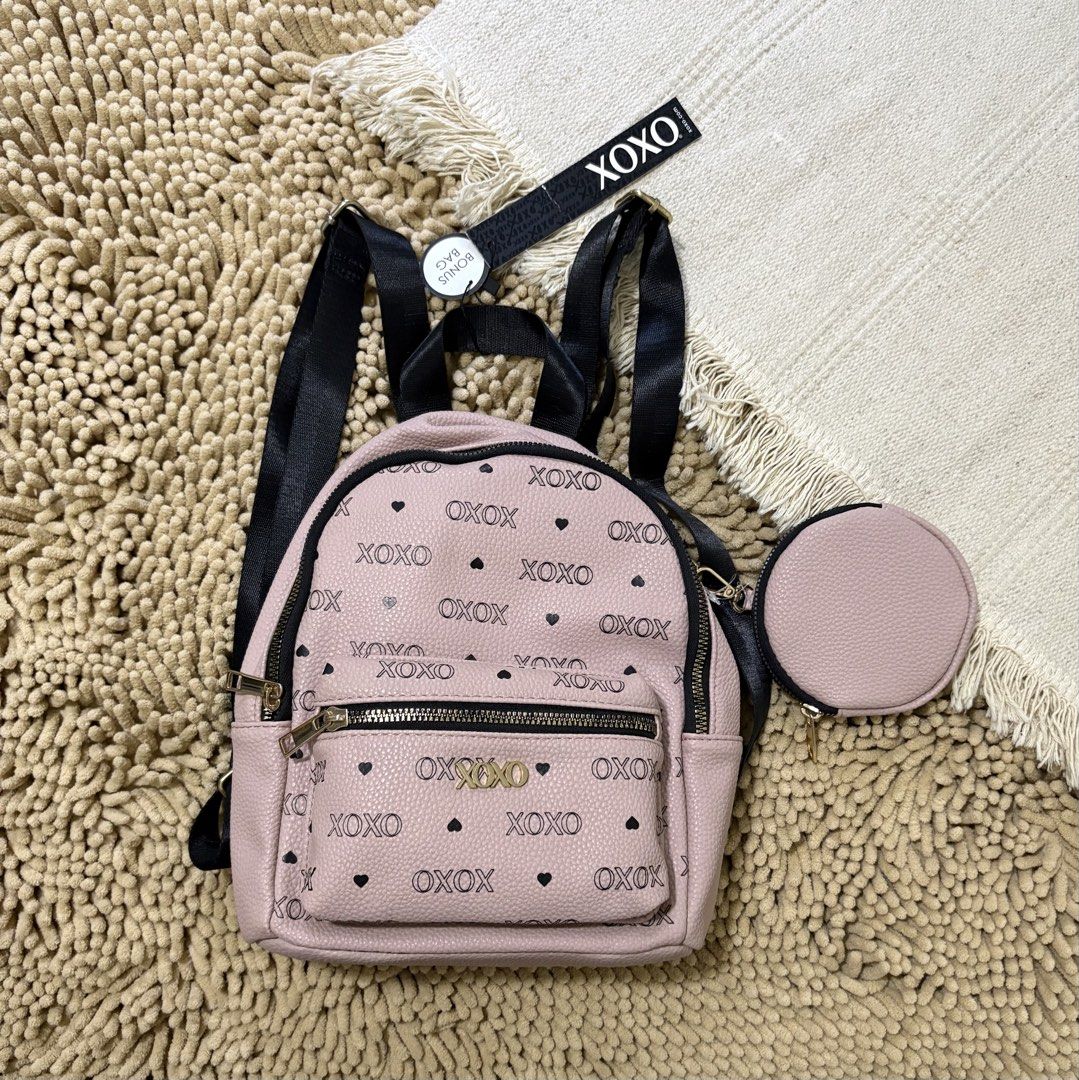 Imported XOXO mini PINK backpack hearts design (Category: Backpacks) located in Quezon City. Submitted by heartshop.ph (Listing ID 1466778869, Image 1). Description: minimal stain inside the bag due to storage/ old stock item hence low posted price Original XOXO backpack with coin purse/ Imported.