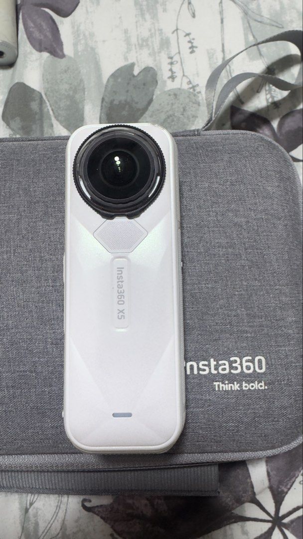 Insta360 X5 camera with case and accessories bundle (Category: Cameras) located in Dasmarinas. Submitted by JD1997 (Listing ID 1466778393, Image 2). Description: - Complete Insta360 X5 action camera bundle - Includes gray zip carrying case and charging accessories - Comes with spare battery housing - Variety of selfie sticks, tripod stand, and neck mount harness with thumbscrews included - Sold as one complete set, ready for your next trip or fil