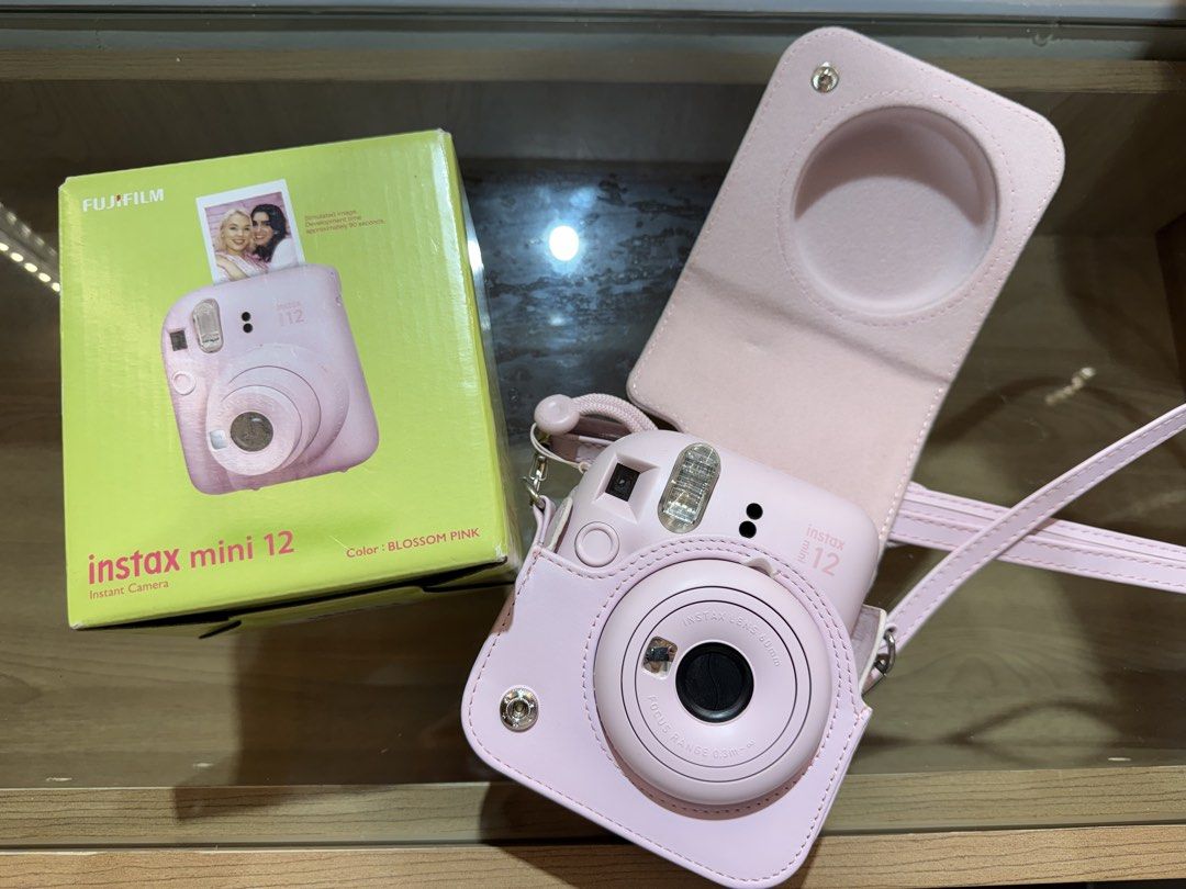 INSTAX mini 12 (Category: Cameras) located in Cainta. Submitted by dark_angel1824 (Listing ID 1466934726, Image 1). Description: INSTAX mini 12 blossom pink 🌸 With free film and case💕 no issues at all RFS: upgrade .
