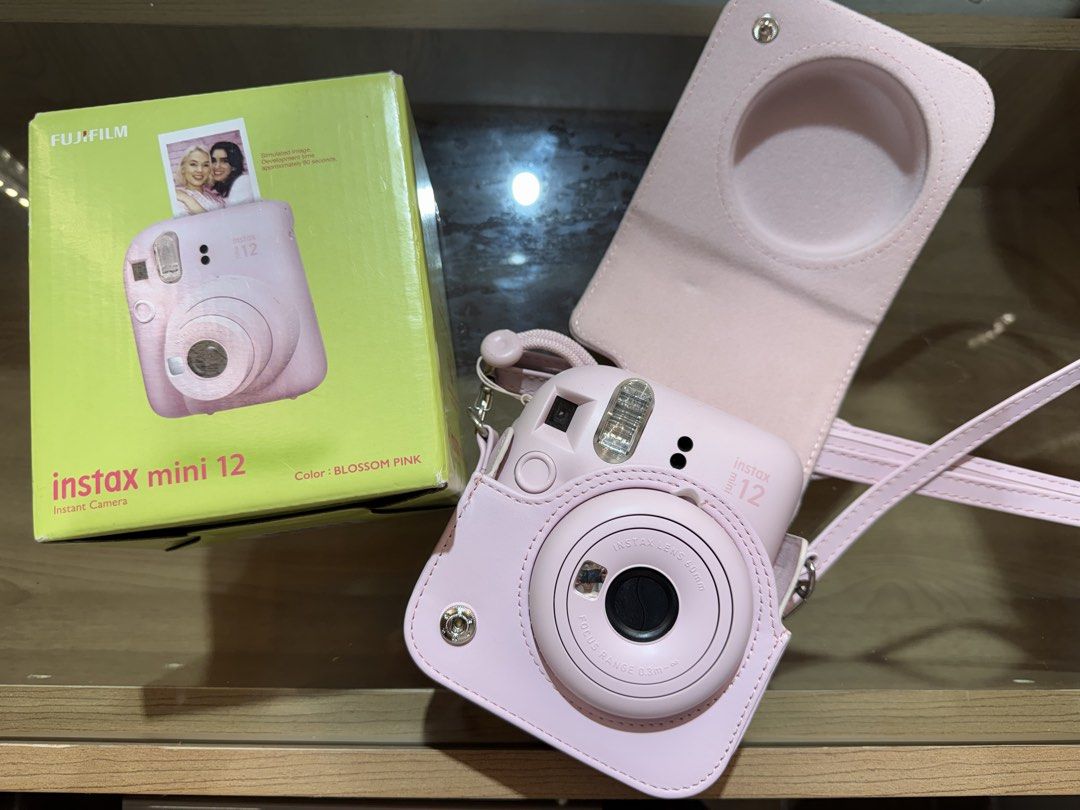 INSTAX mini 12 (Category: Cameras) located in Cainta. Submitted by dark_angel1824 (Listing ID 1466934726, Image 2). Description: INSTAX mini 12 blossom pink 🌸 With free film and case💕 no issues at all RFS: upgrade .