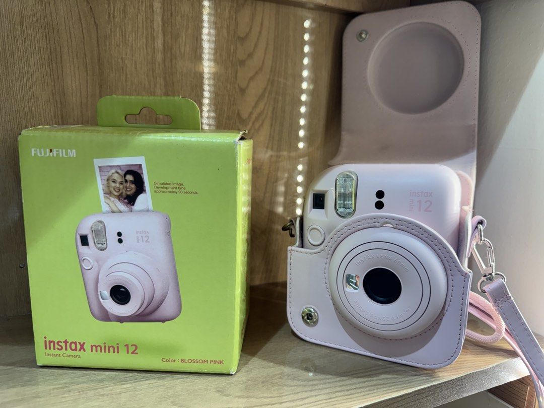 INSTAX mini 12 (Category: Cameras) located in Cainta. Submitted by dark_angel1824 (Listing ID 1466934726, Image 3). Description: INSTAX mini 12 blossom pink 🌸 With free film and case💕 no issues at all RFS: upgrade .