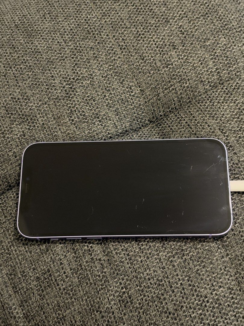 iPhone 12, Purple, 128GB (Category: iPhone 12 Series) located in Pasig City. Submitted by coffee.books.etc (Listing ID 1466923641, Image 2). Description: ✅ Still comes with box ✅ Max battery capacity: 75% ✅ No carrier lock/sim restrictions ✅ Wear & tear/scratches (more visible when screen is off) ✅ Can include a charger if needed RFS: Upgraded.