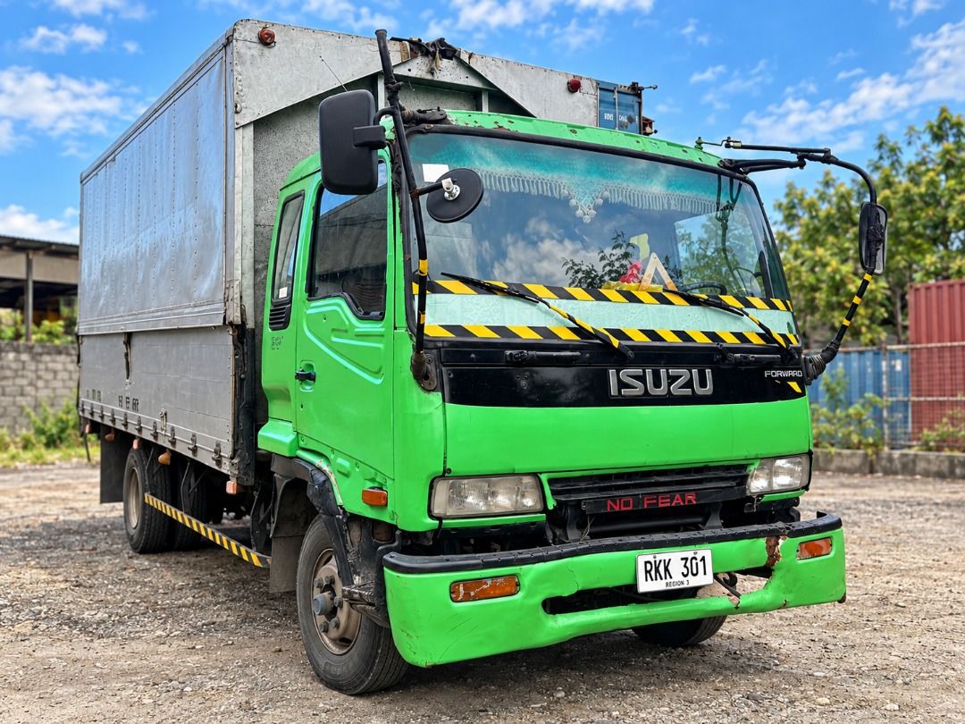 Isuzu Forward Manual (Category: Used Cars) located in Caloocan City. Submitted by trucklistinginquiries (Listing ID 1466829698, Image 1). Description: 1995 ISUZU FORWARD 6-WHEELER WING VAN Price: 450000 Negotiable Location: Liloan, Cebu -7,127cc / 7.1L, 6-cylinder diesel -Manual transmission -Aluminum wing van cargo body -Green | Plate RKK301 -New batteries; engine starts -Both wings open -ORIX fully paid CONDITION: Used, selling as-is. Steering 